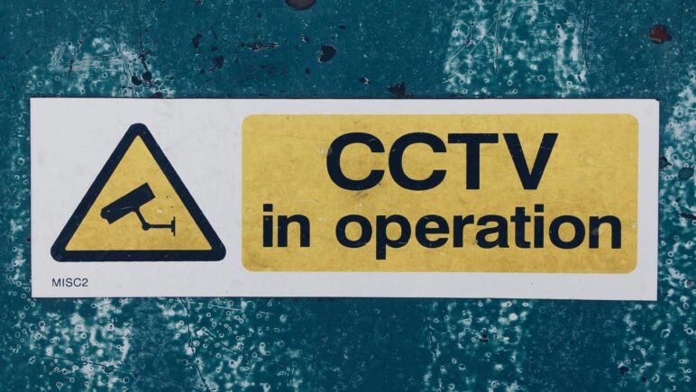 CCTV in operation sign on wall