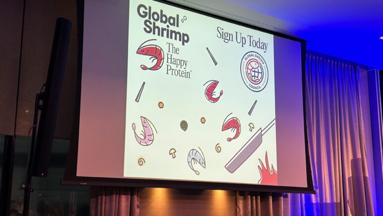 Image of projection screen at Global Shrimp Forum 2024 showing Global Shrimp The Happy Protein branding logos