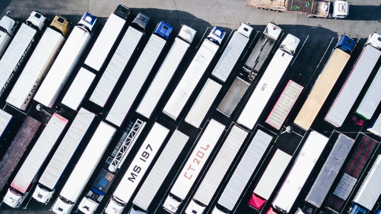 Image of overhead view of lorries in a lorry park